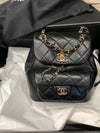 CHANEL Black lambskin Mini Duma Drawstring Backpack / Gold Hardware