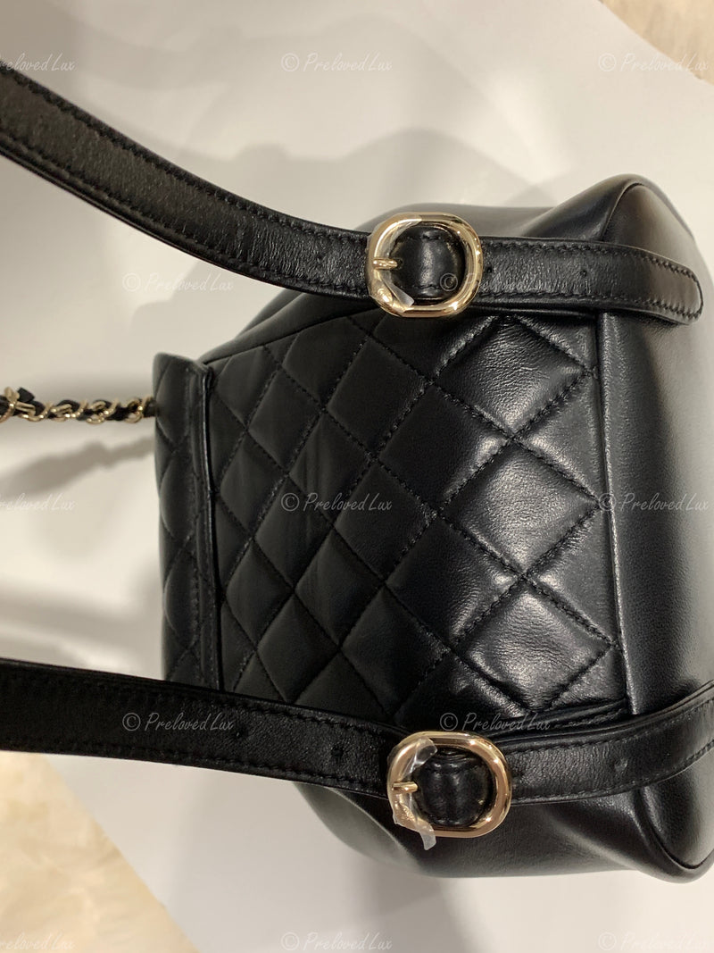 CHANEL Black lambskin Mini Duma Drawstring Backpack / Gold Hardware