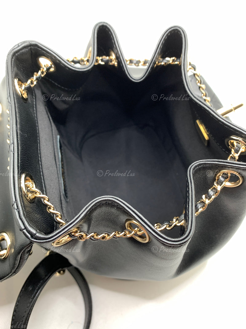 CHANEL Black lambskin Mini Duma Drawstring Backpack / Gold Hardware