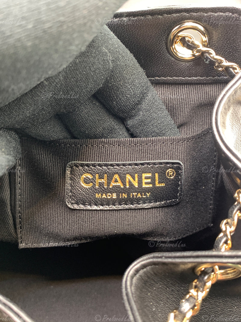 CHANEL Black lambskin Mini Duma Drawstring Backpack / Gold Hardware