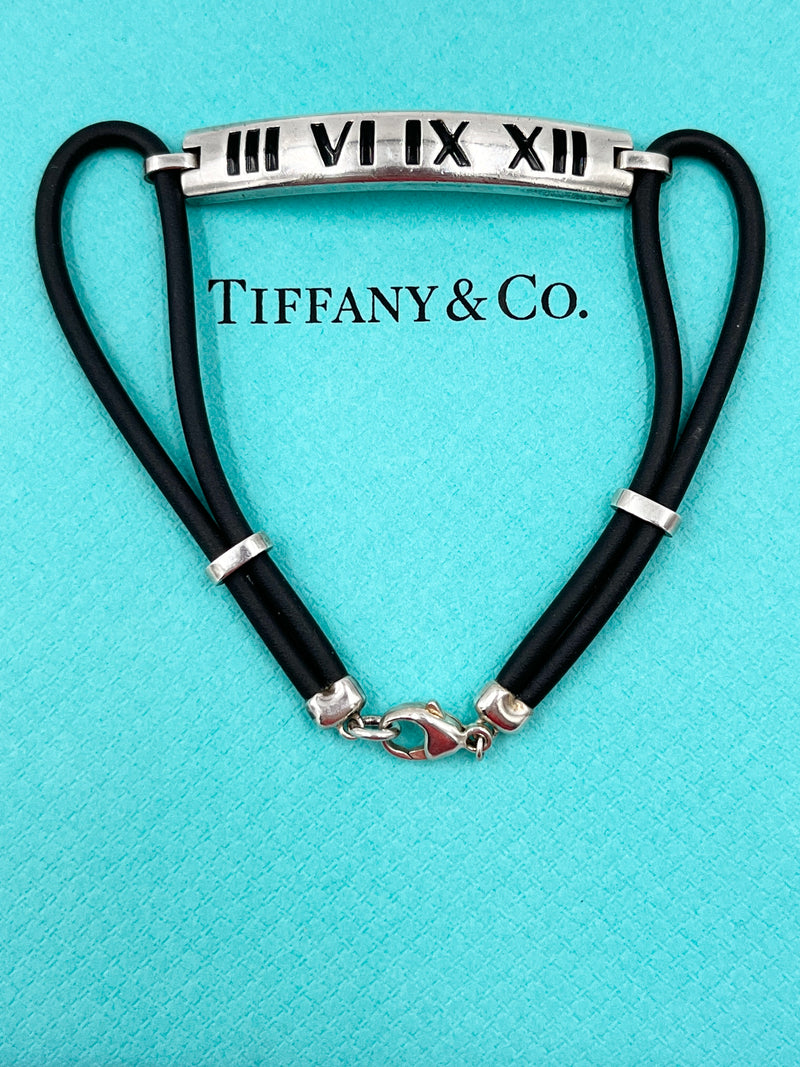 Tiffany 
Co Atlas Roman Numeral Bar Black Rubber Cord Bracelet