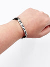 Tiffany 
Co Atlas Roman Numeral Bar Black Rubber Cord Bracelet