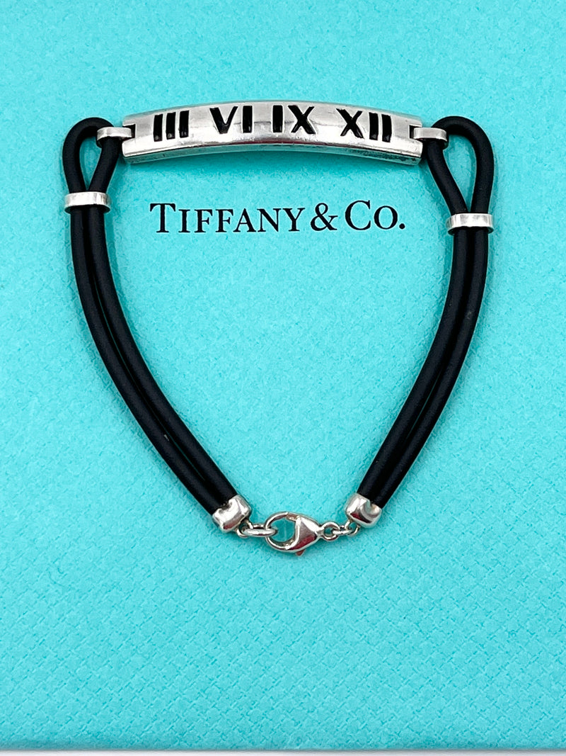 Tiffany 
Co Atlas Roman Numeral Bar Black Rubber Cord Bracelet