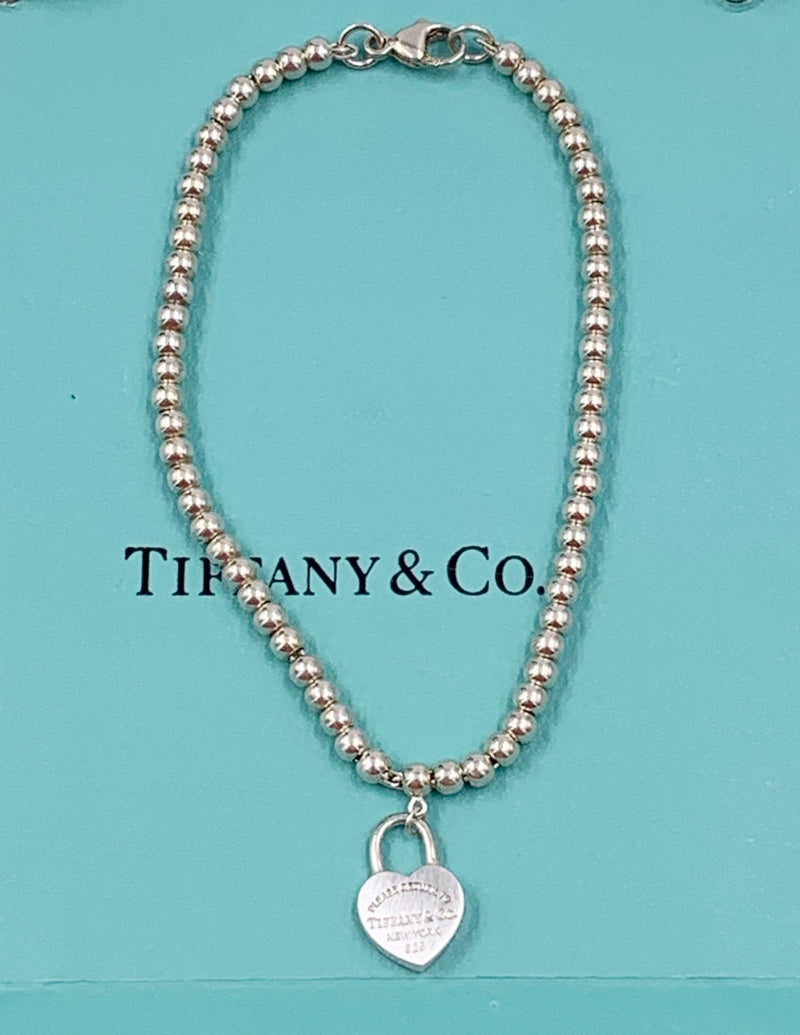 Sold-Tiffany 
Co 925 Silver Return to Tiffany Lock Bead Bracelet