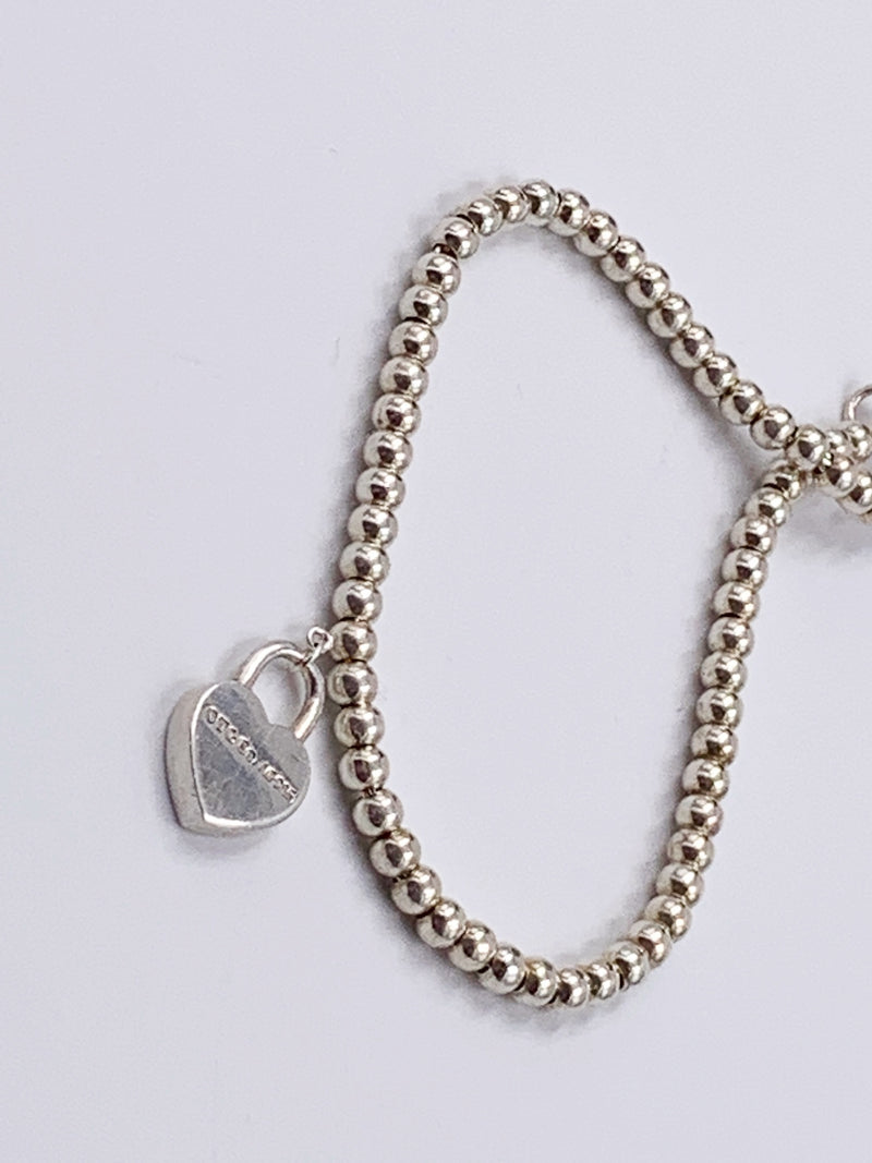 Sold-Tiffany 
Co 925 Silver Return to Tiffany Lock Bead Bracelet