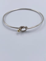 Sold-Tiffany 
Co 925 (Silver) 750 (Gold) Love Knot Bangle