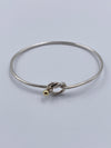 Sold-Tiffany 
Co 925 (Silver) 750 (Gold) Love Knot Bangle