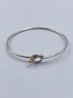 Sold-Tiffany 
Co 925 (Silver) 750 (Gold) Love Knot Bangle