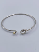 Sold-Tiffany 
Co 925 (Silver) 750 (Gold) Love Knot Bangle