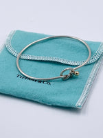 Sold-Tiffany 
Co 925 (Silver) 750 (Gold) Love Knot Bangle